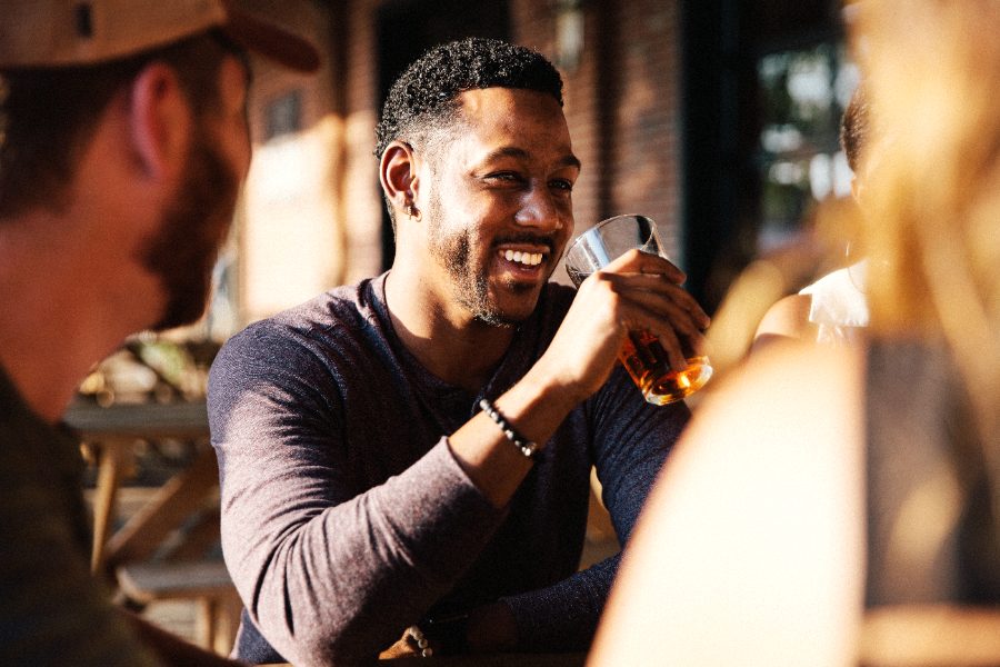 Friends laughing over a drink